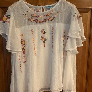 Francesca’s white blouse with flower embroidery